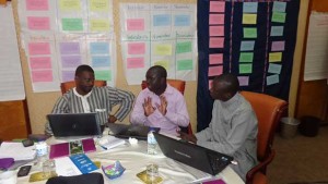 Participants from Senegal work on their data analysis