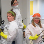 Members of The DHS Program Analysis team dress up as Indoor Residual Spray (IRS) Sprayers for Halloween. IRS sprayers are integral to malaria prevention and control.